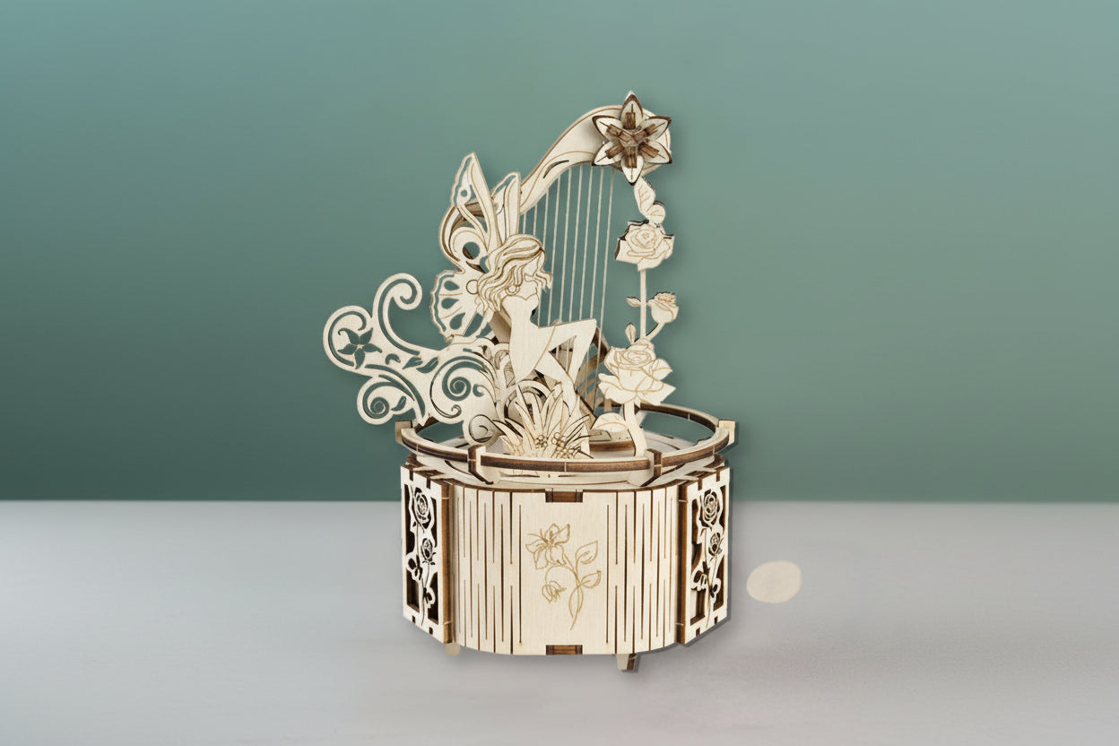 Wooden fairy music box with harp and flowers on a gray background
