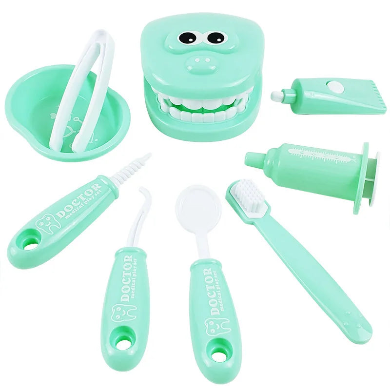 Mint green dental care set for children with toothbrush, toothpaste, and other tools on a white background.