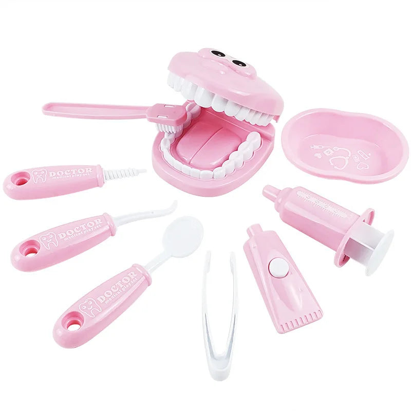 Pink dental toy set with various components on a white background
