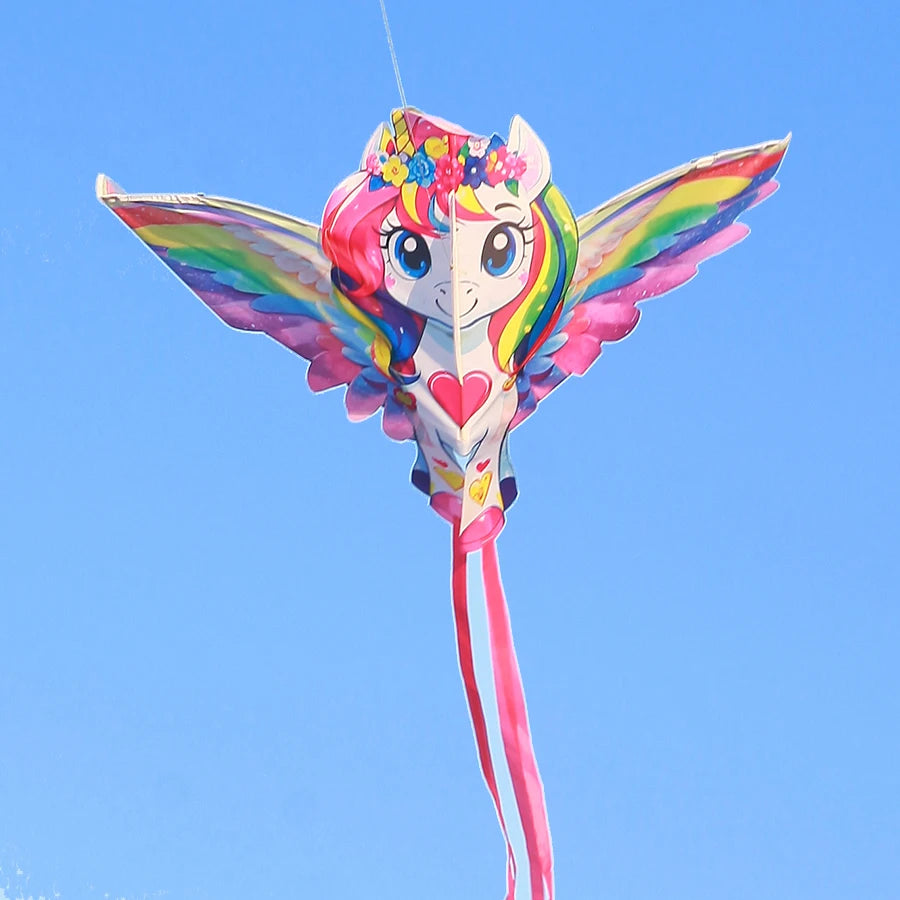Colorful kite shaped like a cartoon character against a clear blue sky