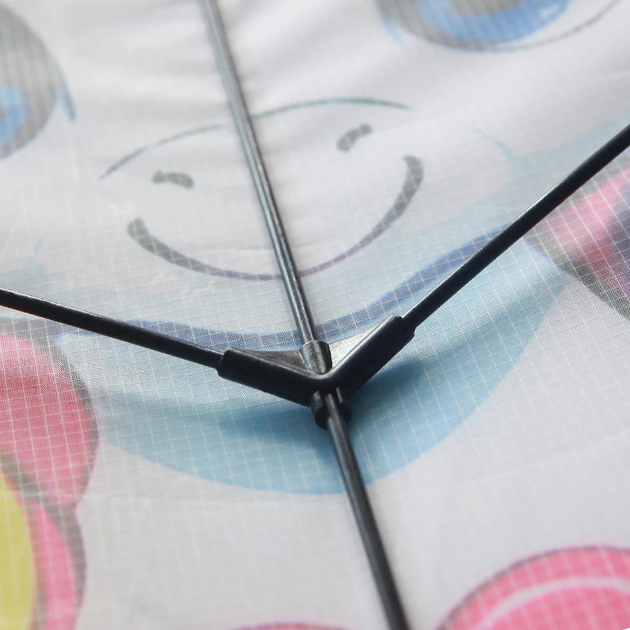 Close-up of a clock with colorful abstract design in the background