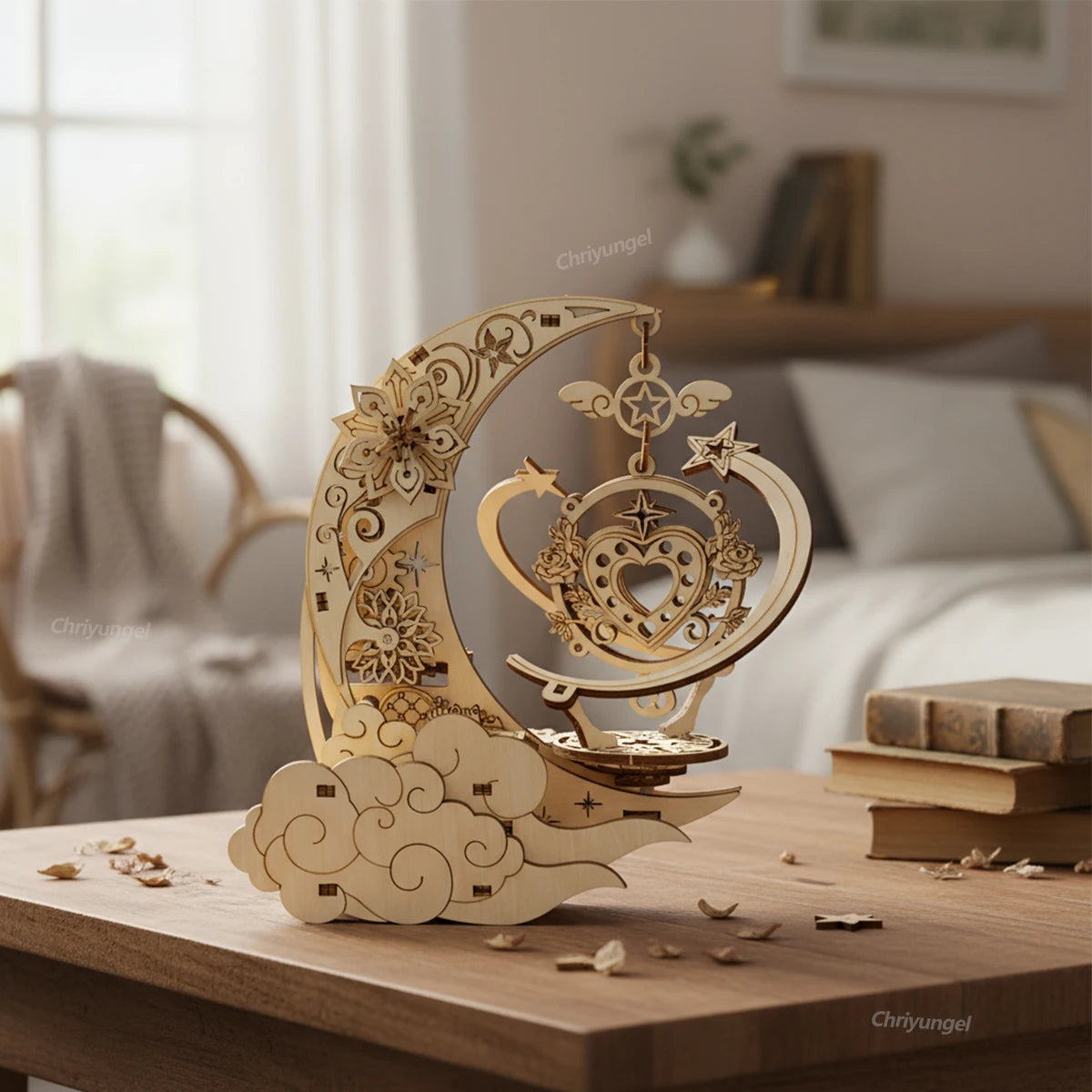 Decorative wooden moon and star ornament on a table with a blurred indoor background