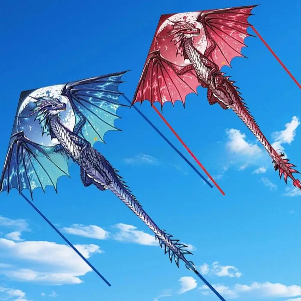 Two dragon-shaped kites against a blue sky with white clouds.