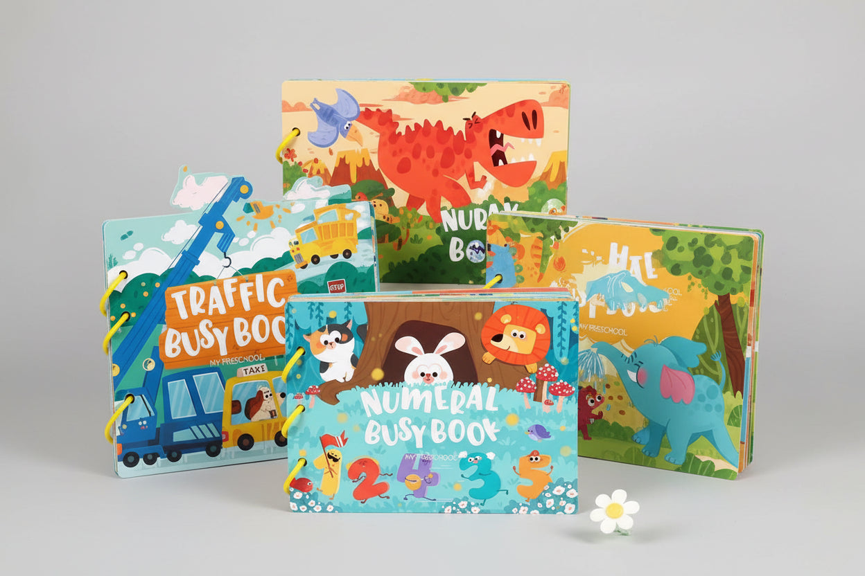 Children's busy books with colorful illustrations on a wooden surface.
